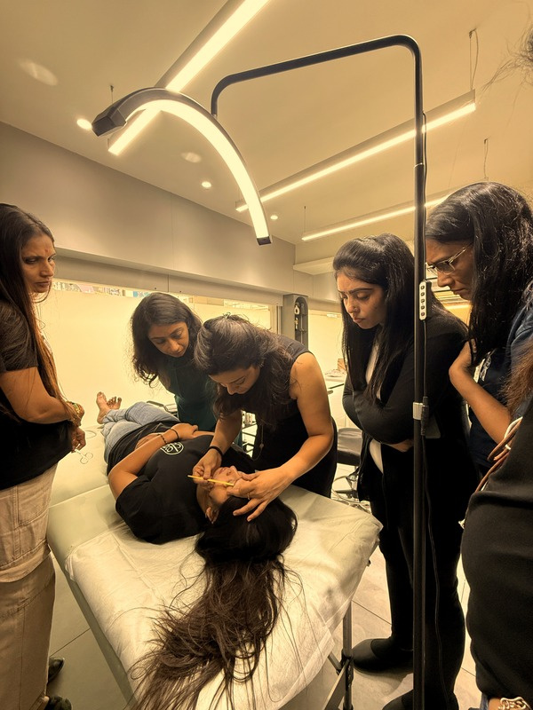 Bhavini Rathod guiding artists during hands-on permanent makeup training